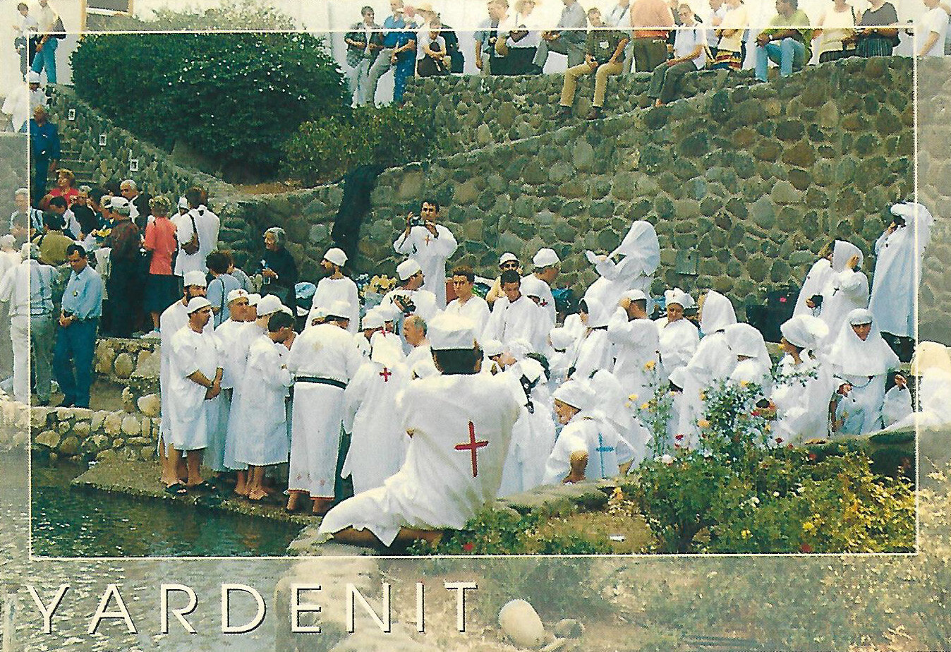 Postcard: white-robed pilgrims on the stone steps at Yardenit